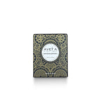 Bougie parfumée Tahiti Candles au bois de santal, 80g, dans un emballage décoré de motifs polynésiens traditionnels.