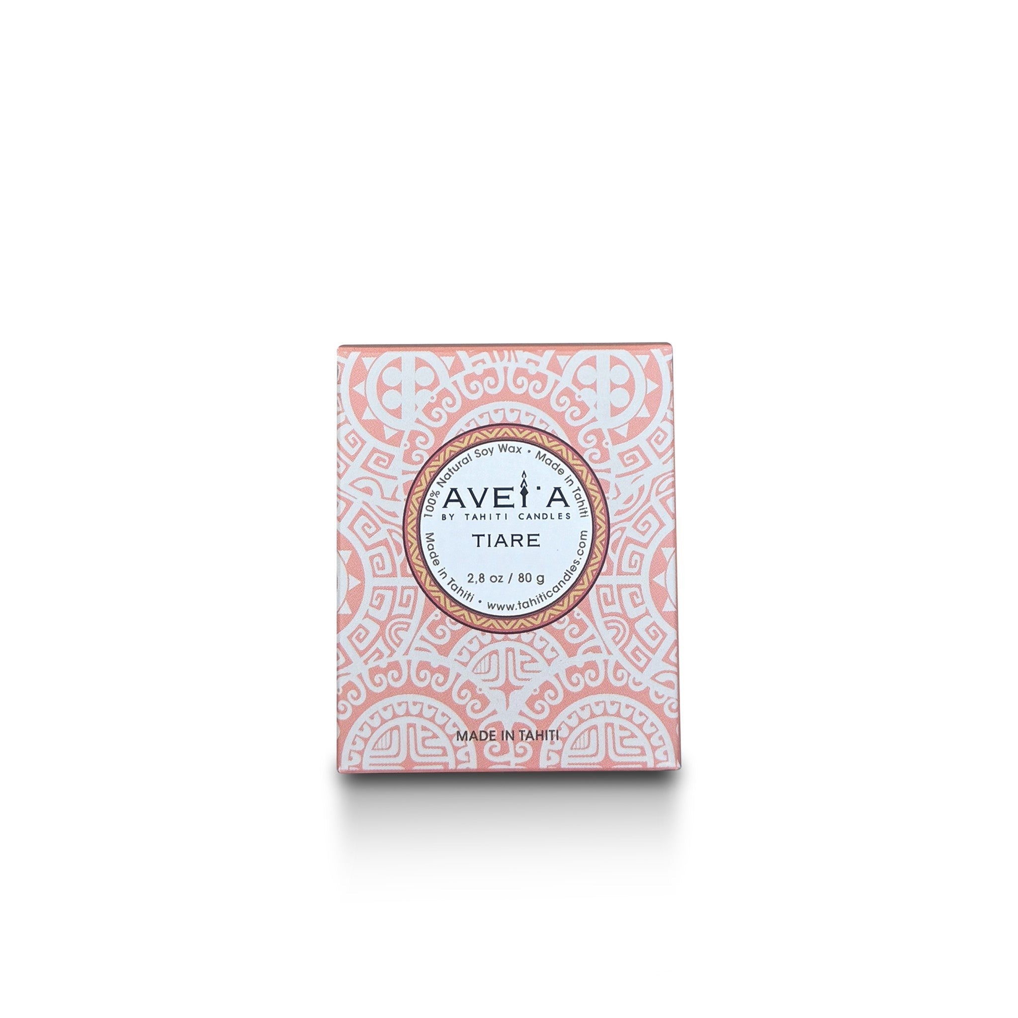 Bougie parfumée Tahiti Candles 80g au parfum de fleur de Tiare dans son emballage décoré de motifs polynésiens roses