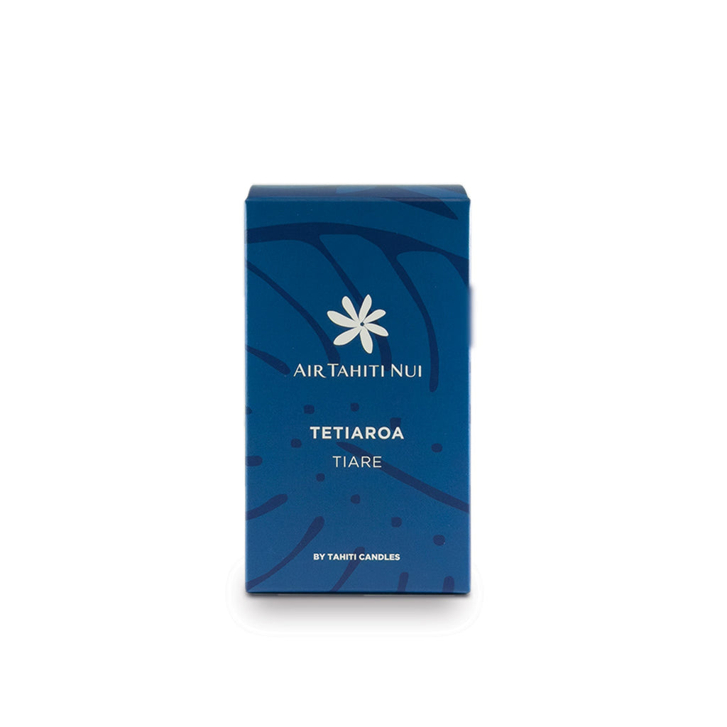 Boîte de bougie parfumée Tahiti Candles Air Tahiti Nui Tetiaroa Tiare bleue avec motif de feuilles tropicales