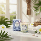 Bougie parfumée Tahiti Candles Sea Salt 80g dans un pot en verre avec son emballage décoré de motifs bleus polynésiens